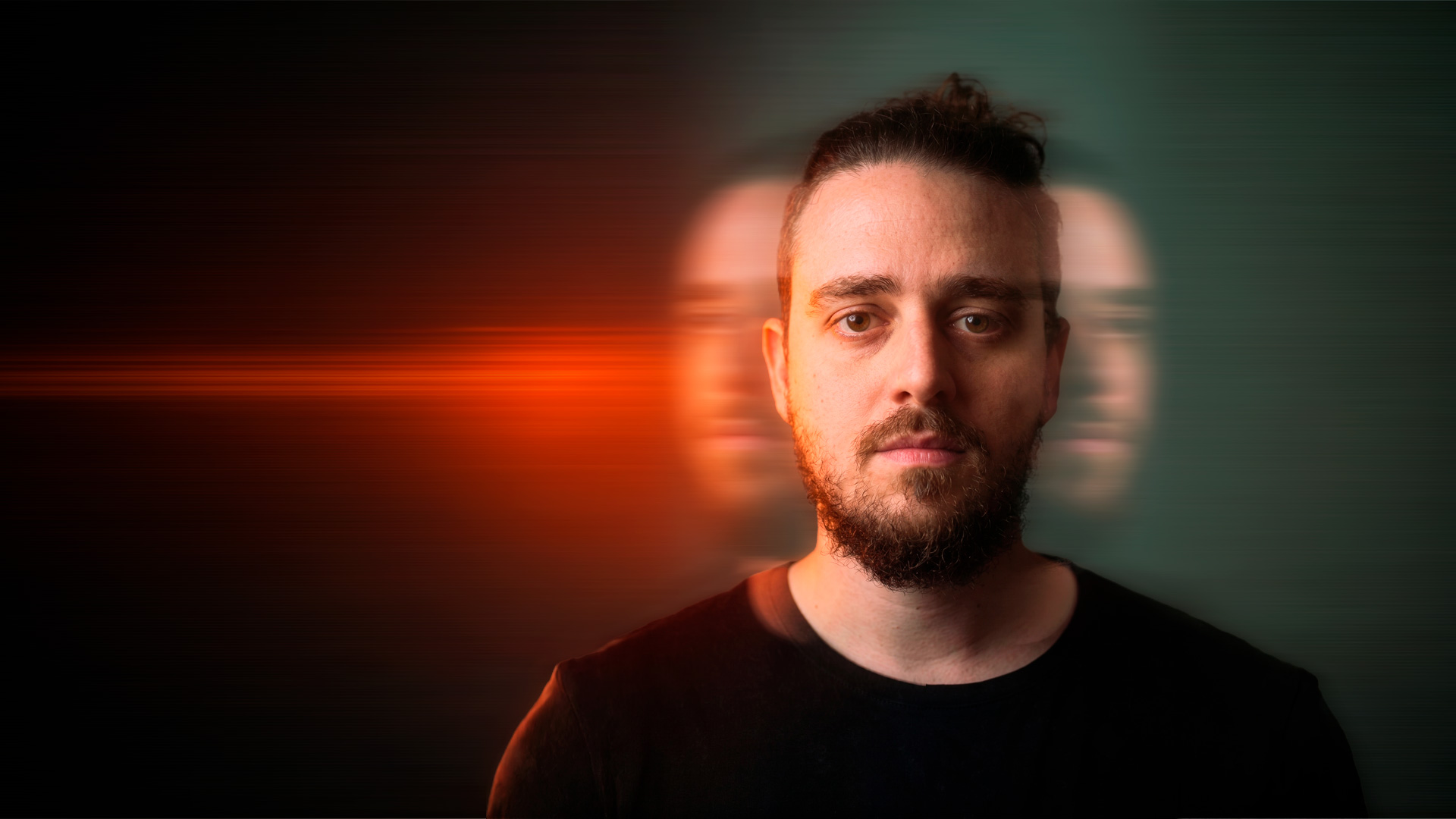 Retrato editorial de Álvaro con luz roja y verde sobre fondo oscuro